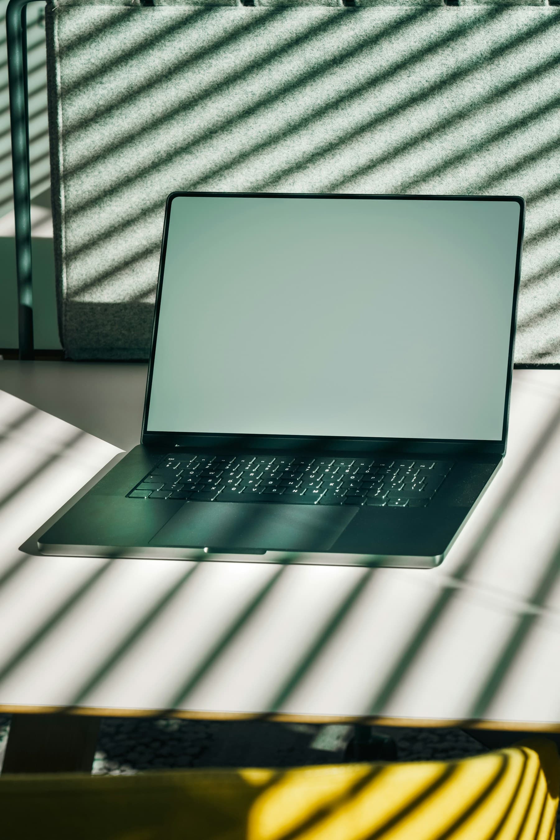Laptop mockup with a blank screen and soft shadows